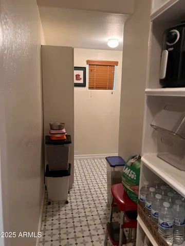 a view of a hallway view with wooden floor and windows