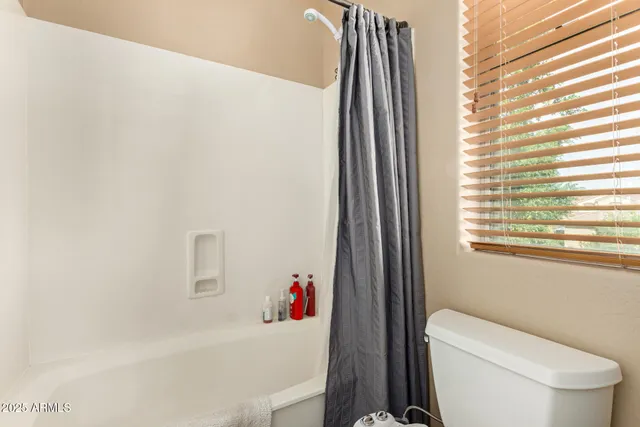 a view of a patio with a table chairs and a yard