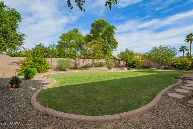 a view of backyard with patio