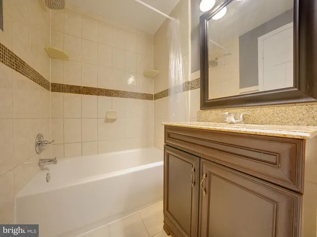 a bathroom with a bathtub and a sink