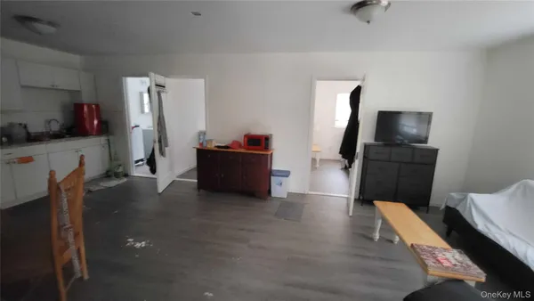 a view of kitchen with furniture and wooden floor