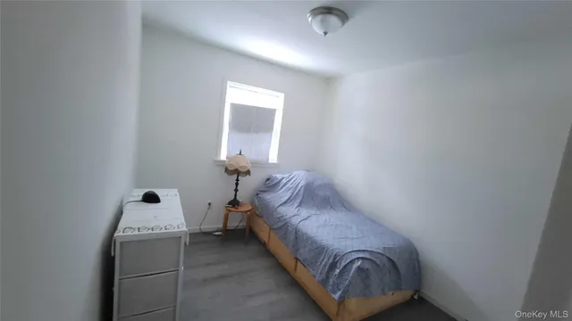a room with a bed and window