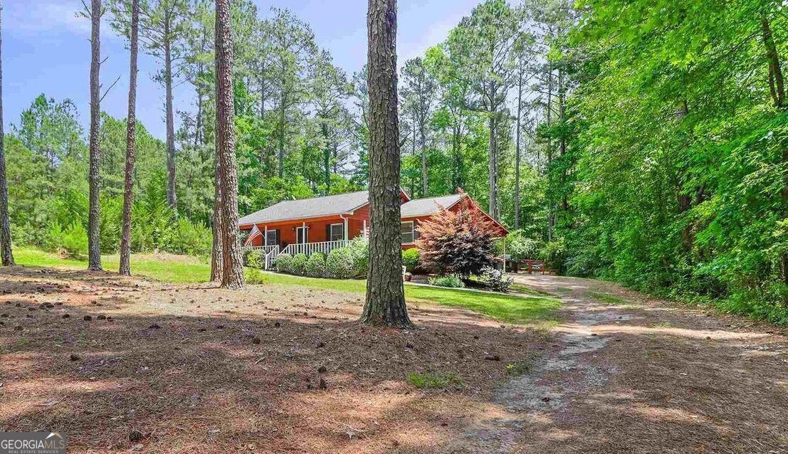 468 Davis Road Fayetteville, GA 30215 - Photo 2 of 13 a front view of a house with a yard and an trees