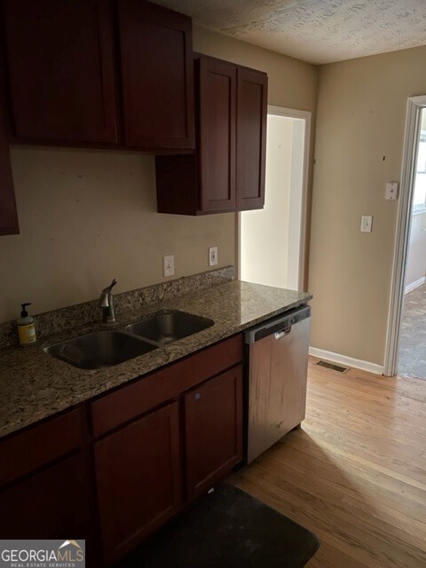 468 Davis Road Fayetteville, GA 30215 - Photo 5 of 13 a kitchen with stainless steel appliances granite countertop a sink stove and cabinets