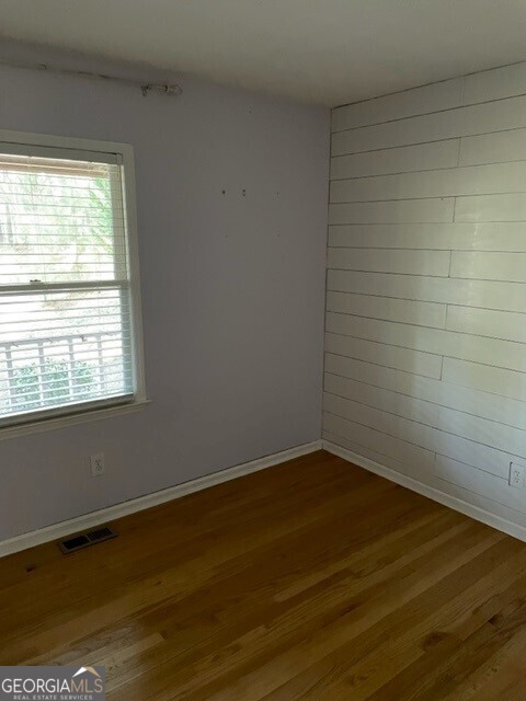 468 Davis Road Fayetteville, GA 30215 - Photo 9 of 13 a view of a small space with wooden floor and a window
