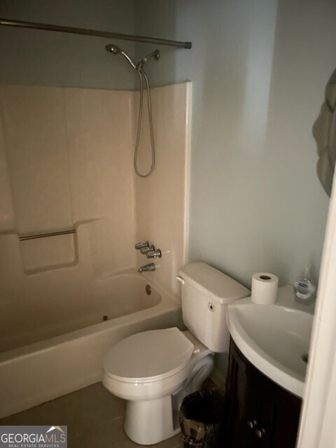 468 Davis Road Fayetteville, GA 30215 - Photo 10 of 13 a white toilet sitting next to a bath tub and a shower