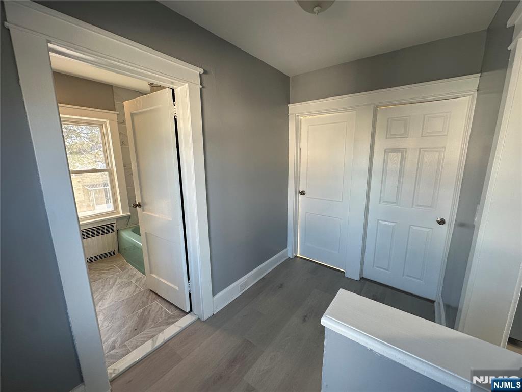 23 South 1st Street, Unit 2 Bergenfield, NJ 07621 - Photo 3 of 12 a view of room with window and hardwood floor