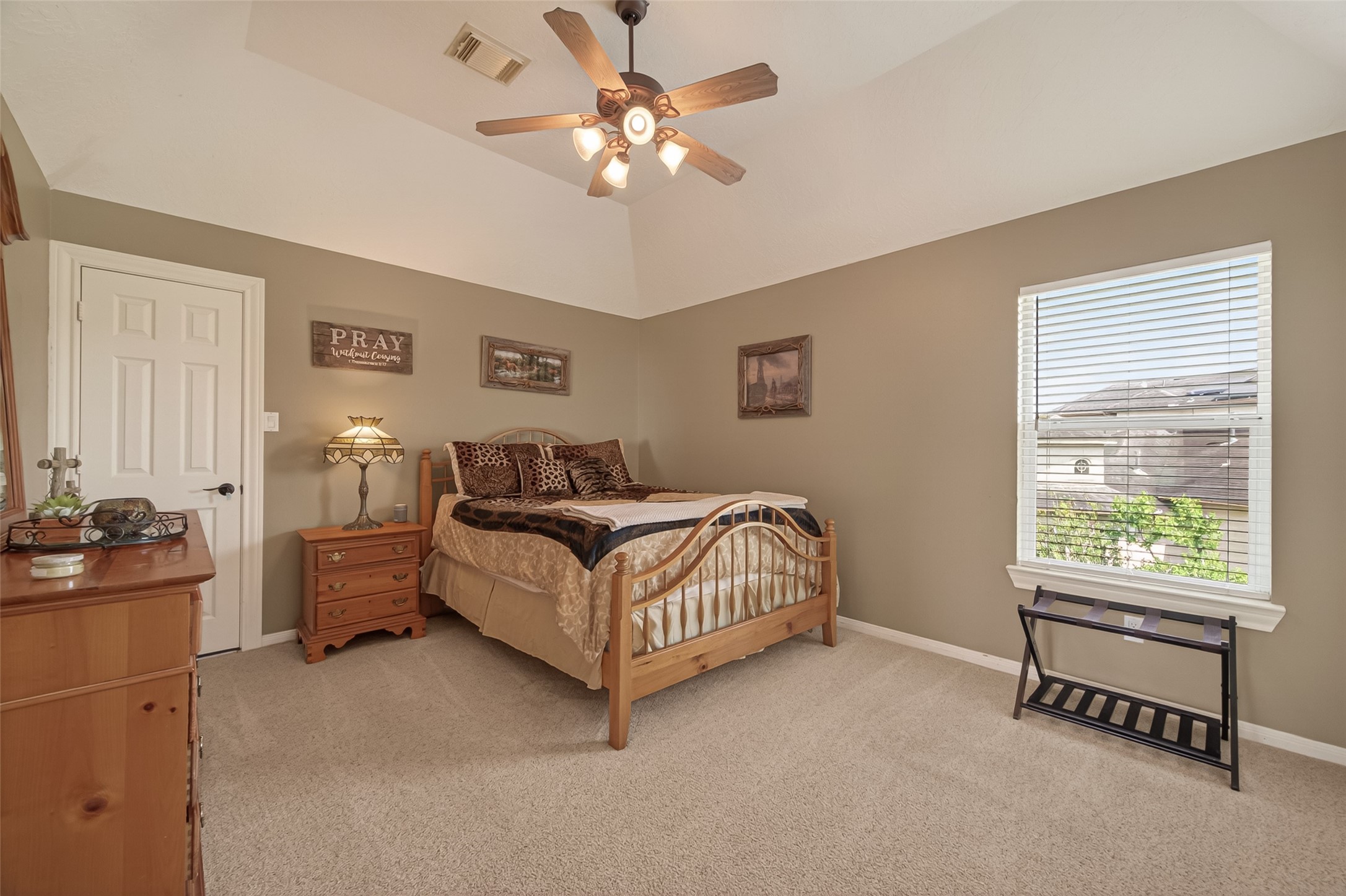2319 Braer Ridge Drive Katy, TX 77494 - Photo 31 of 50 a bedroom with a bed and a chandelier
