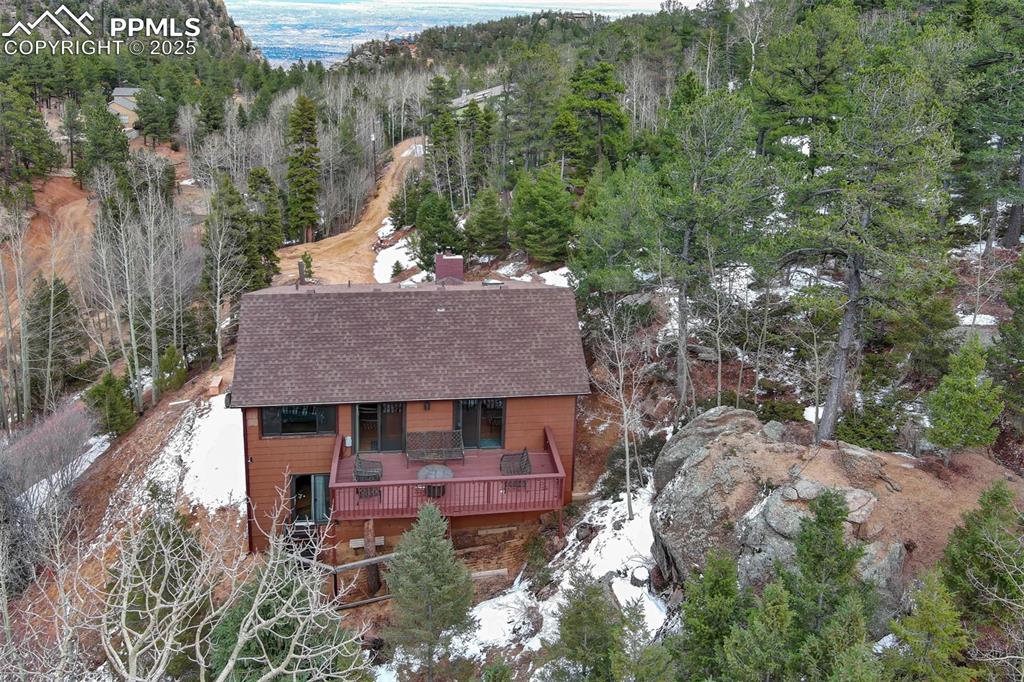 5865 Waterfall Loop Manitou Springs, CO 80829 - Photo 20 of 45 a aerial view of a house with yard and trees all around
