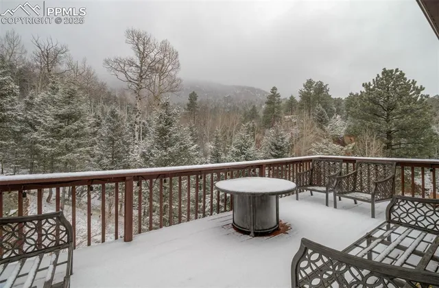 a view of roof deck with furniture