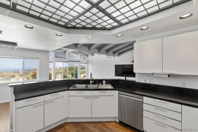 a kitchen with a sink and cabinets