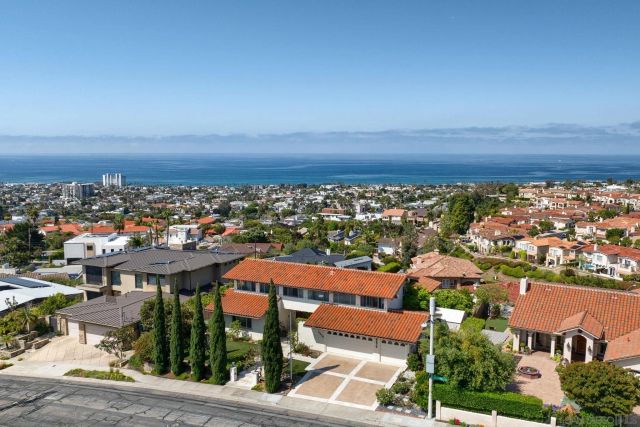 an aerial view of residential house and green space