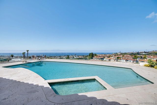 a view of a swimming pool and an ocean view