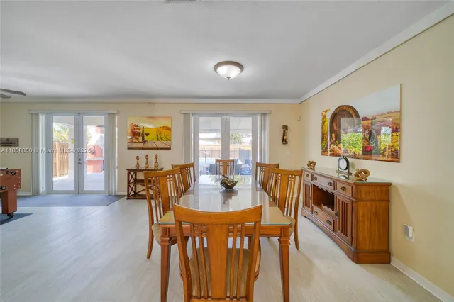 a dining room with furniture and wooden floor