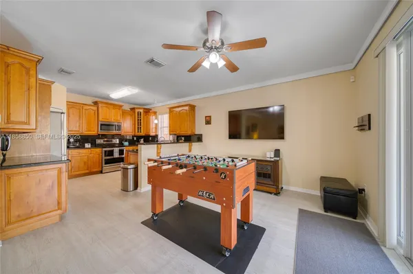 a view of a livingroom with furniture and a flat screen tv