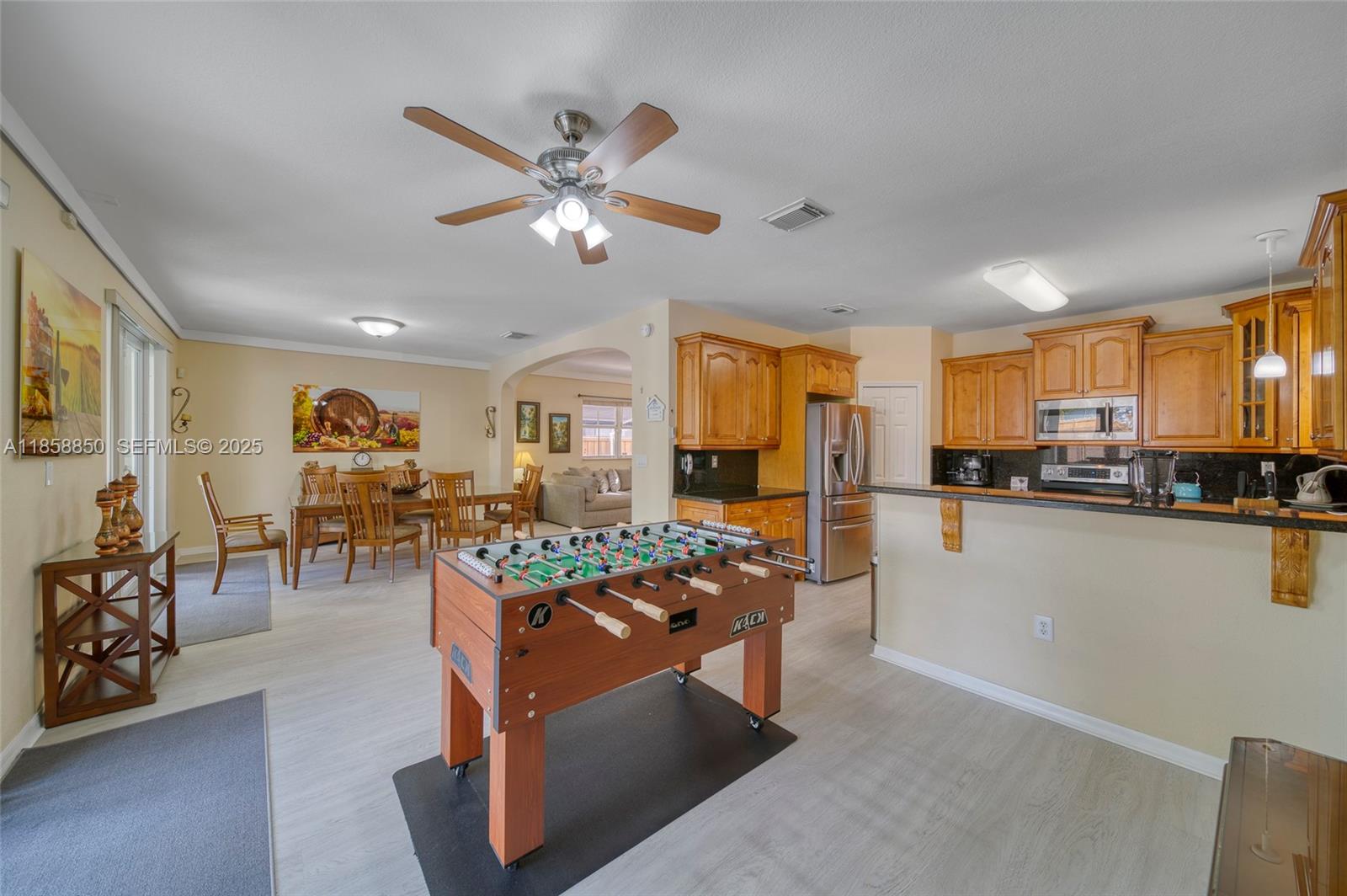 16403 Southwest 79th Lane, Unit 16403 Miami, FL 33193 - Photo 17 of 43 a living room with stainless steel appliances granite countertop furniture and a kitchen view