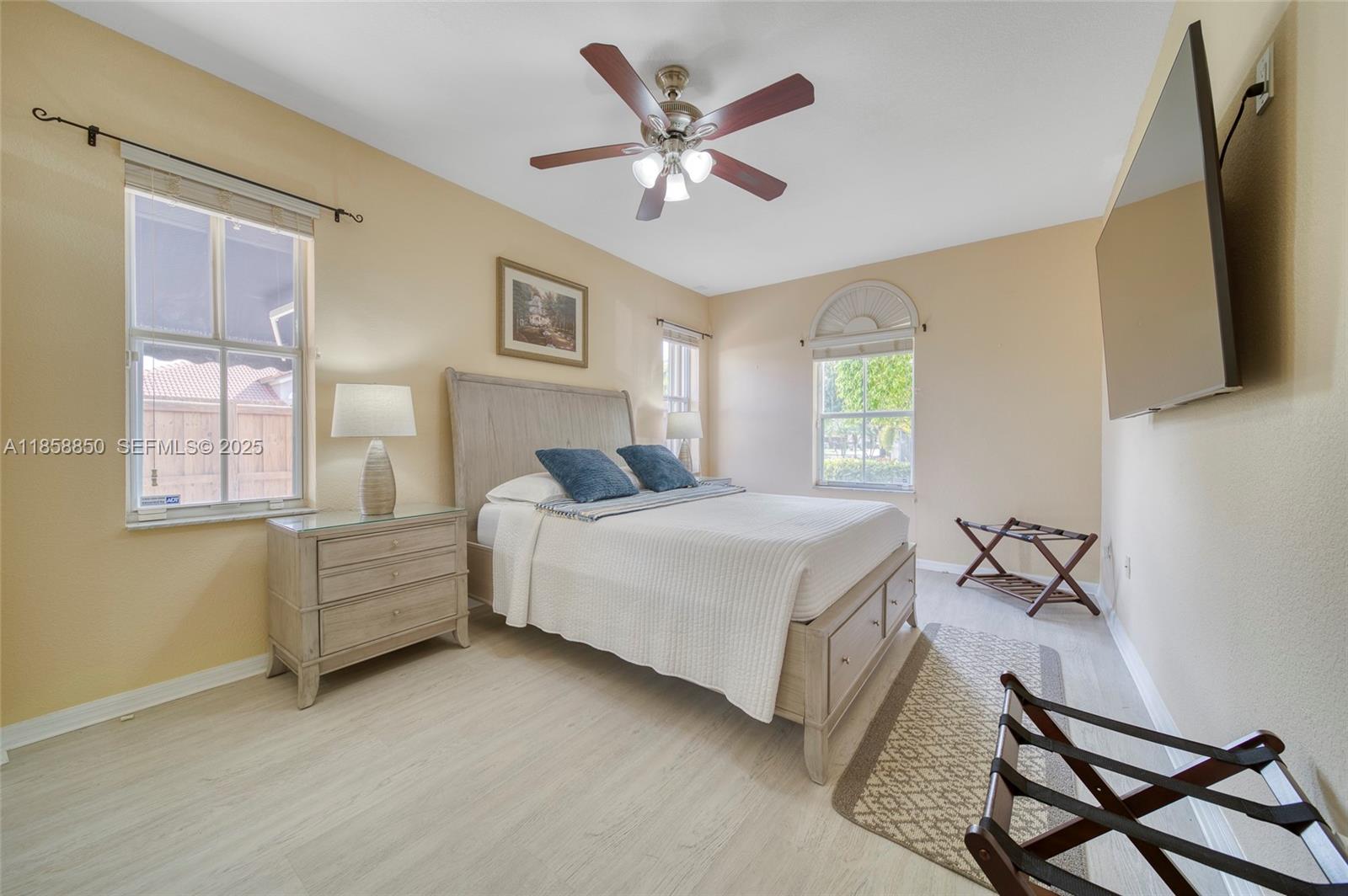 16403 Southwest 79th Lane, Unit 16403 Miami, FL 33193 - Photo 19 of 43 a bedroom with a bed and window