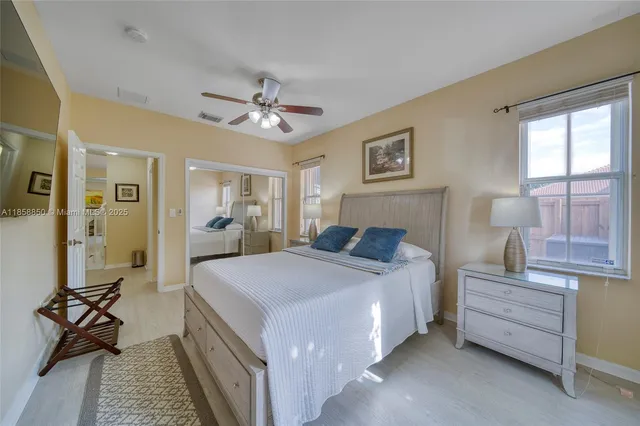 a bed room with a bed and a chandelier