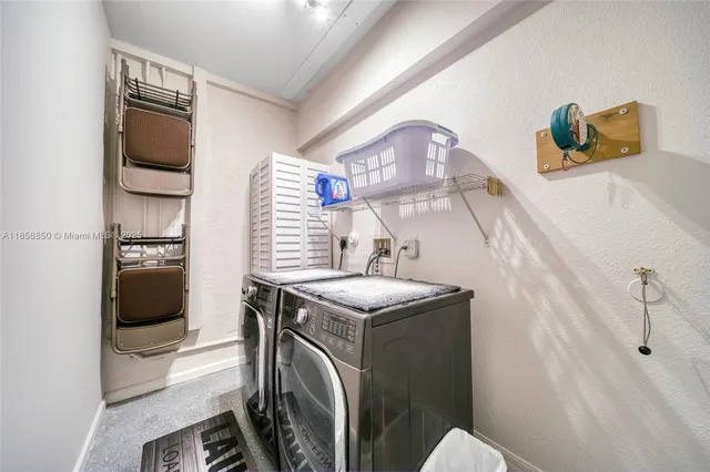 a utility room with washer and dryer