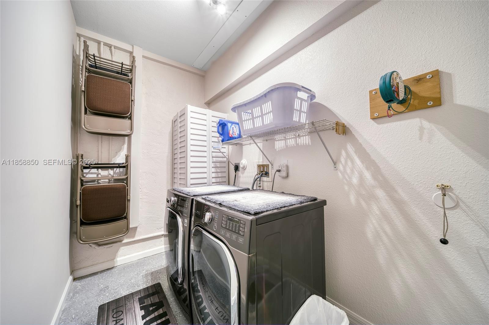 16403 Southwest 79th Lane, Unit 16403 Miami, FL 33193 - Photo 22 of 43 a utility room with washer and dryer