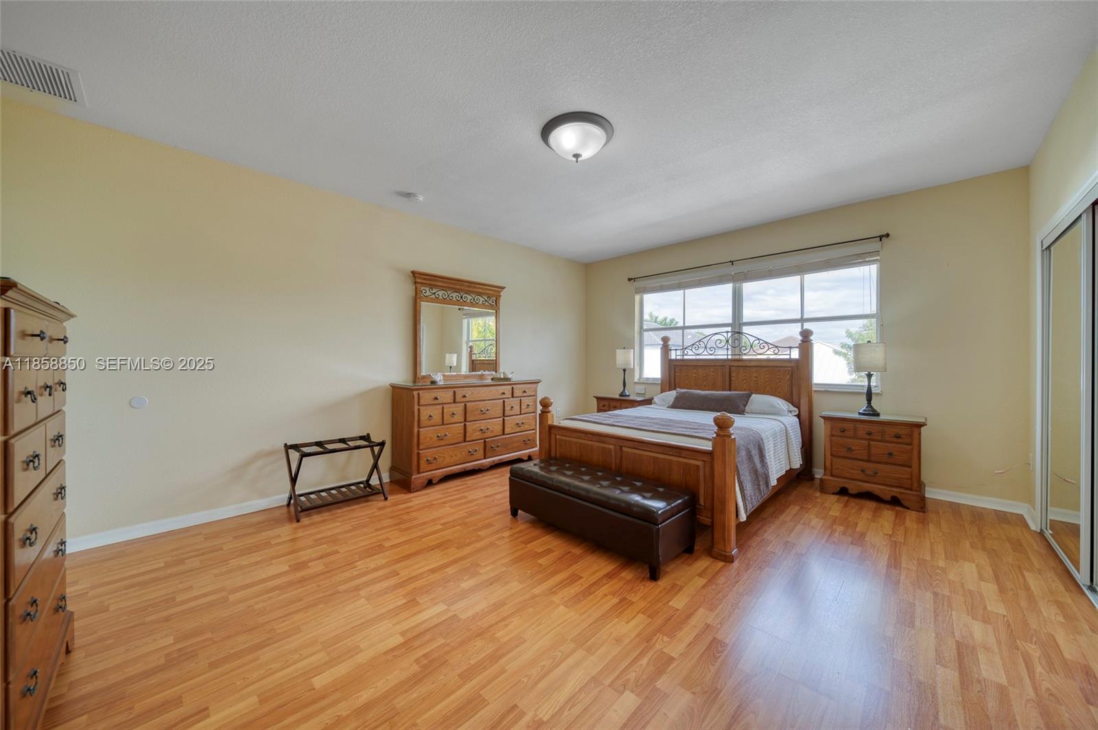 16403 Southwest 79th Lane, Unit 16403 Miami, FL 33193 - Photo 26 of 43 a bedroom with a bed and a window