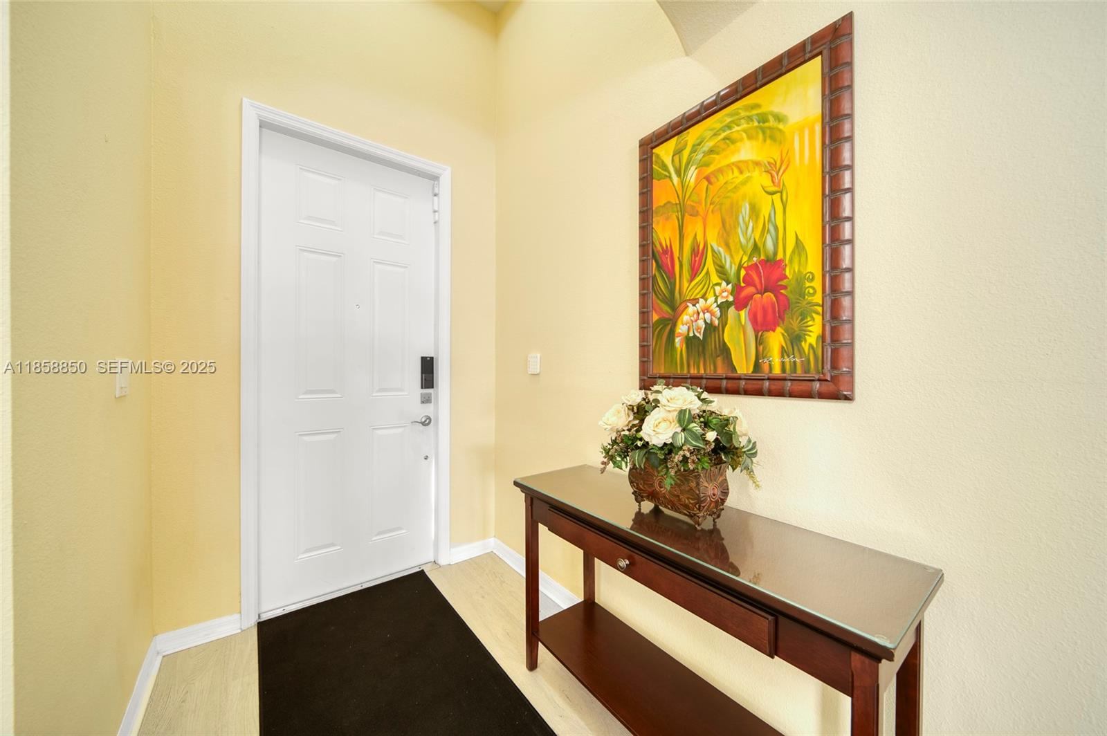 16403 Southwest 79th Lane, Unit 16403 Miami, FL 33193 - Photo 29 of 43 a vase of flowers sitting on a table