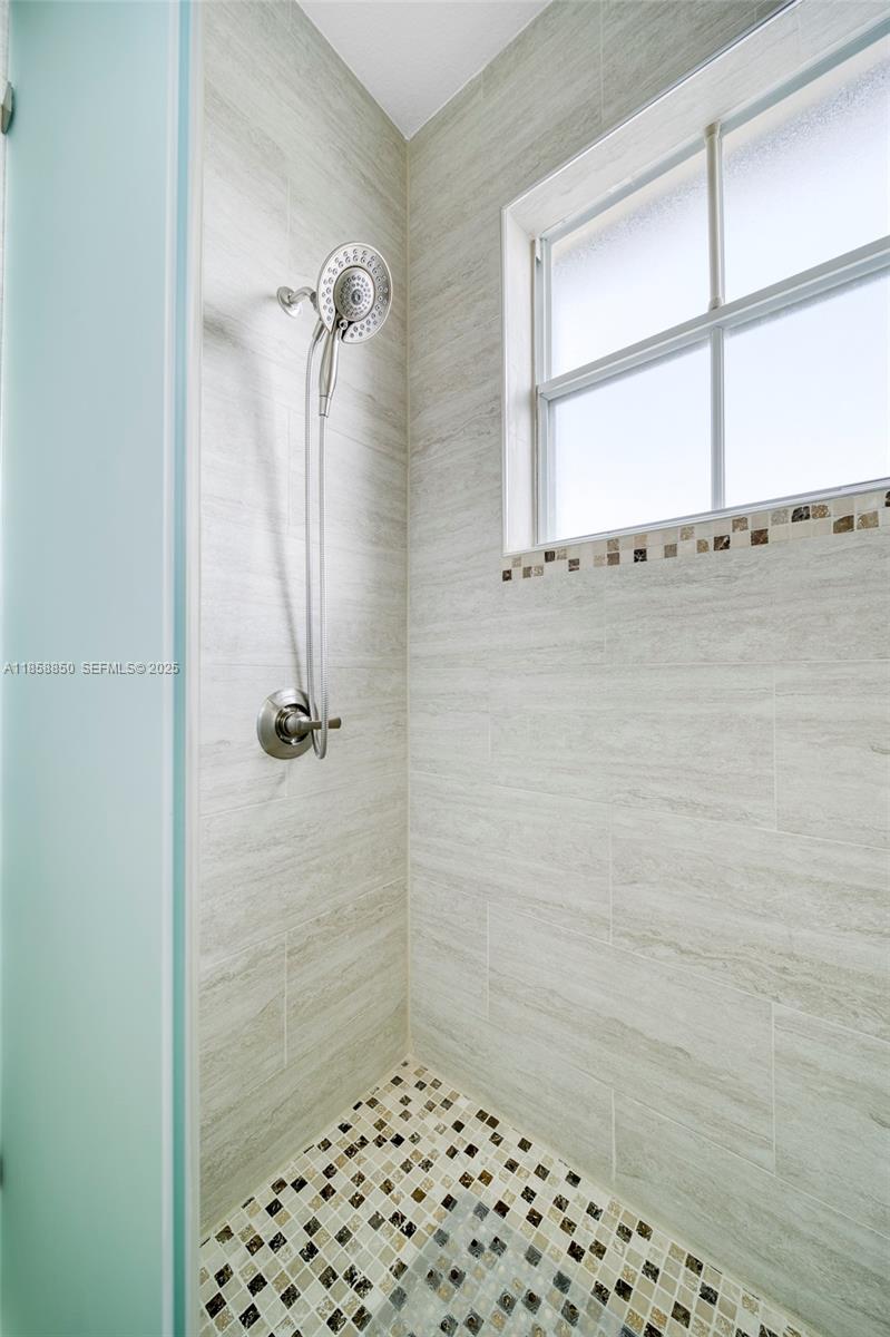 16403 Southwest 79th Lane, Unit 16403 Miami, FL 33193 - Photo 33 of 43 a bathroom with a shower