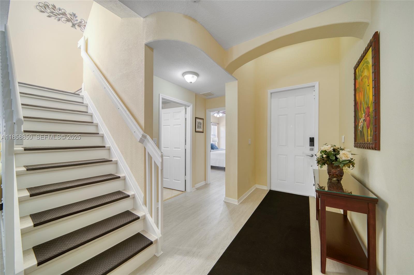 16403 Southwest 79th Lane, Unit 16403 Miami, FL 33193 - Photo 36 of 43 a view of a hallway with wooden floor and staircase