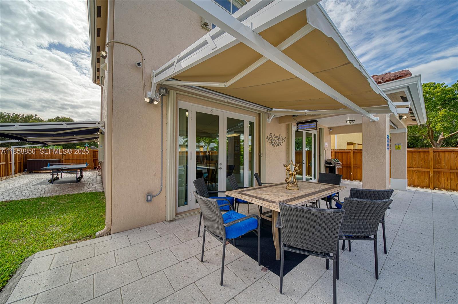16403 Southwest 79th Lane, Unit 16403 Miami, FL 33193 - Photo 43 of 43 a view of a patio with table and chairs and potted plants