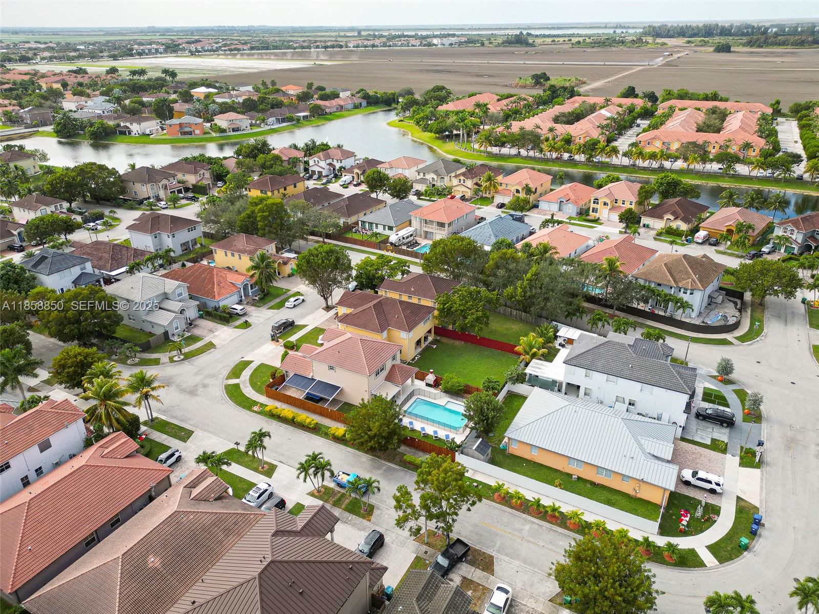 16403 Southwest 79th Lane, Unit 16403 Miami, FL 33193 - Photo 5 of 43 an aerial view of residential houses with outdoor space
