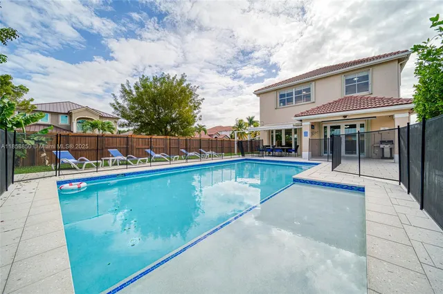 a view of a swimming pool with a patio