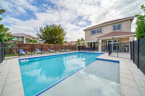 a view of a swimming pool with a patio