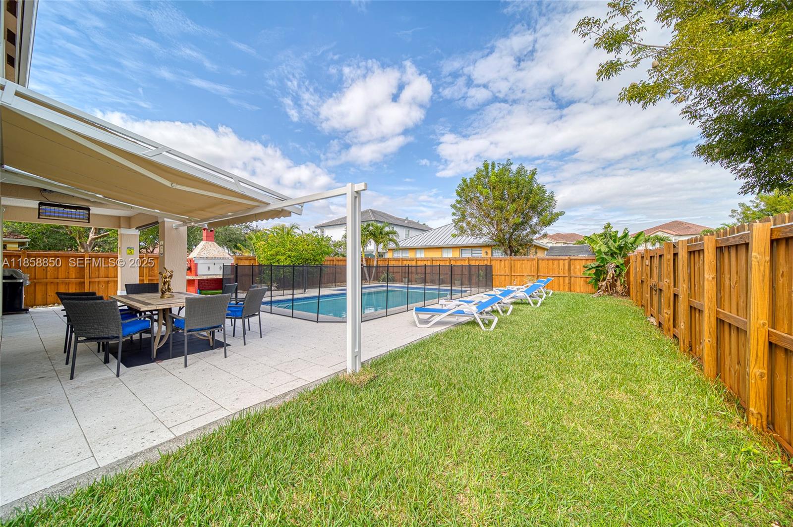 16403 Southwest 79th Lane, Unit 16403 Miami, FL 33193 - Photo 9 of 43 a view of a backyard with sitting area