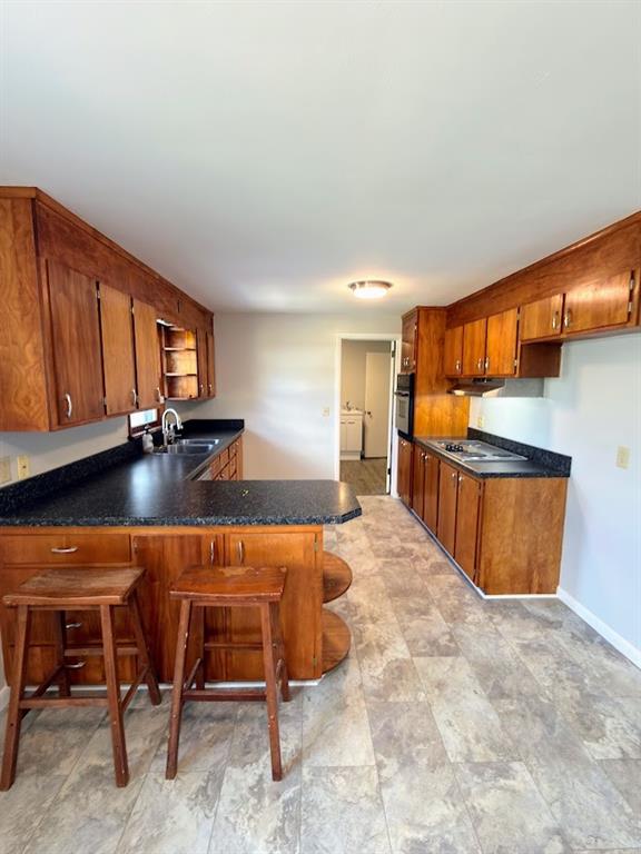 480 South Maysville Road Greenville, PA 16125 - Photo 9 of 20 a kitchen with stainless steel appliances kitchen island granite countertop a table chairs in it and wooden floors