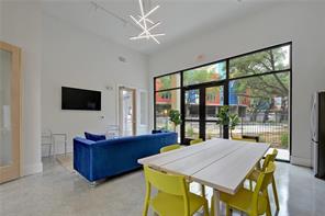 13130 Pond Springs Road, Unit 3214 Austin, TX 78729 - Photo 37 of 40 A vibrant communal space offers high ceilings and abundant natural light.