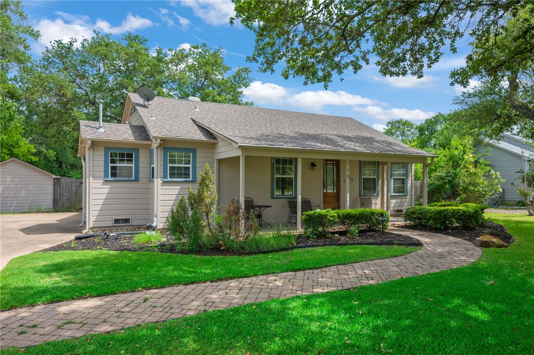 715 Inwood Drive Bryan, TX 77802 - Photo 22 of 34 a view of a house with a yard and plants