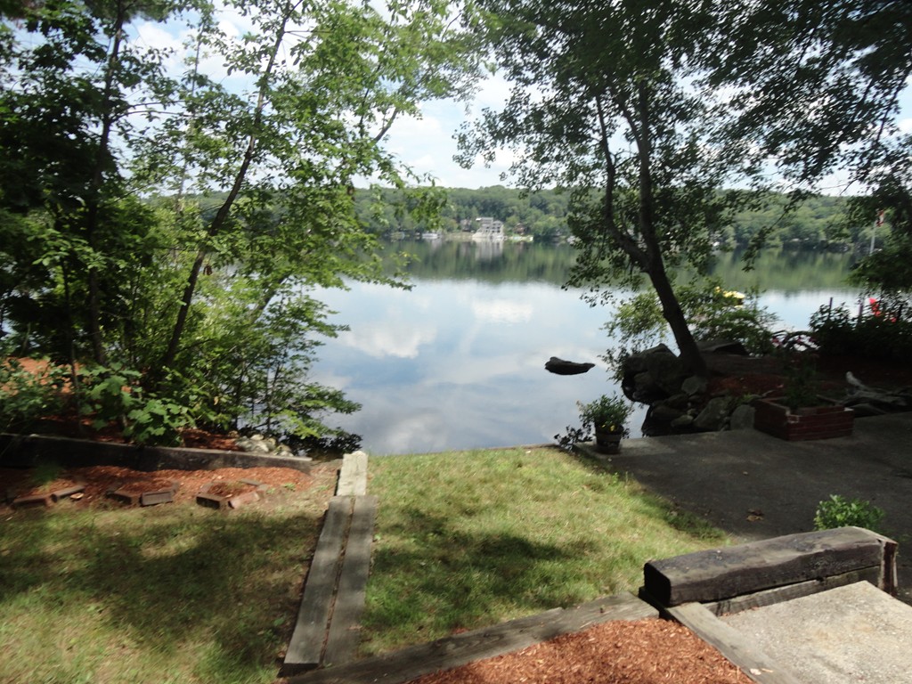 41 Oakhurst Road, Unit 41 Hopkinton, MA 01748 - Photo 3 of 13 a view of a lake from a yard