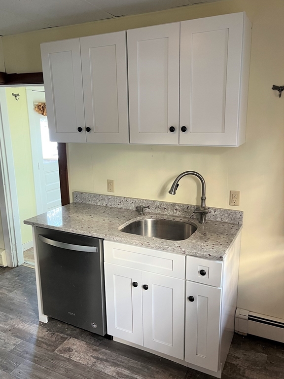 41 Oakhurst Road, Unit 41 Hopkinton, MA 01748 - Photo 6 of 13 a kitchen with white cabinets and sink