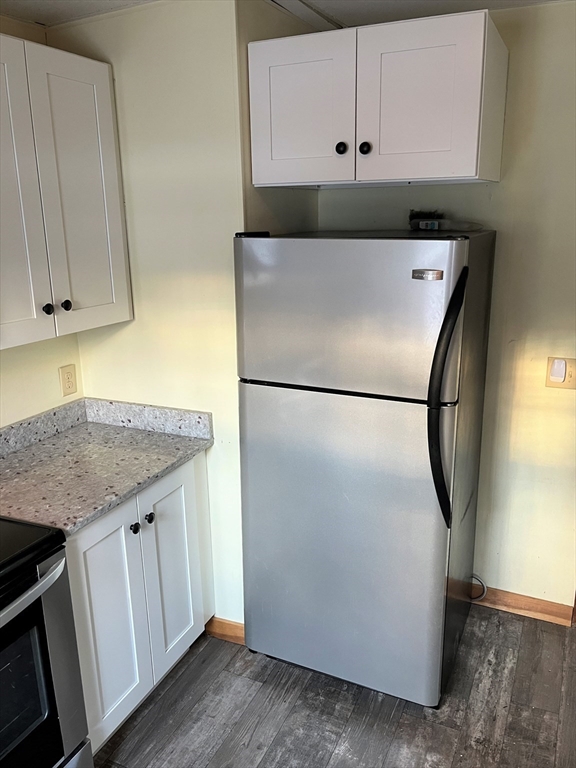 41 Oakhurst Road, Unit 41 Hopkinton, MA 01748 - Photo 8 of 13 a kitchen with a refrigerator and a sink