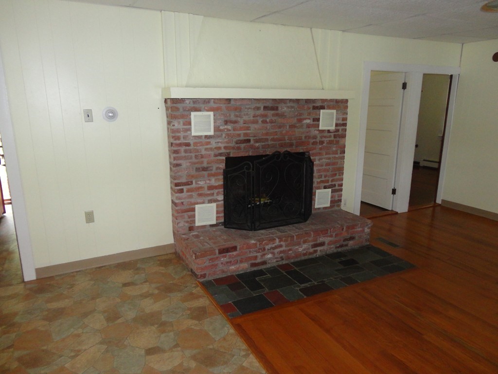 41 Oakhurst Road, Unit 41 Hopkinton, MA 01748 - Photo 9 of 13 a living room with a fireplace
