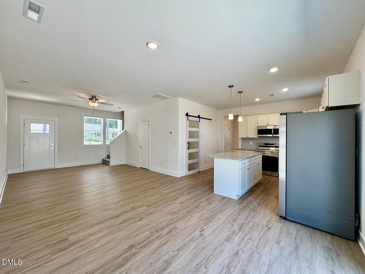 218 George Street, Unit A Four Oaks, NC 27524 - Photo 4 of 28 Dining + Living Room + Kitchen Flow