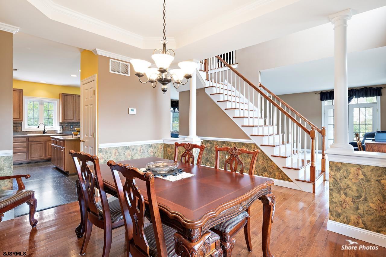 49 Killdeer Hill Road Woodbine, NJ 08270 - Photo 11 of 56 a view of a dining room with furniture a chandelier and wooden floor