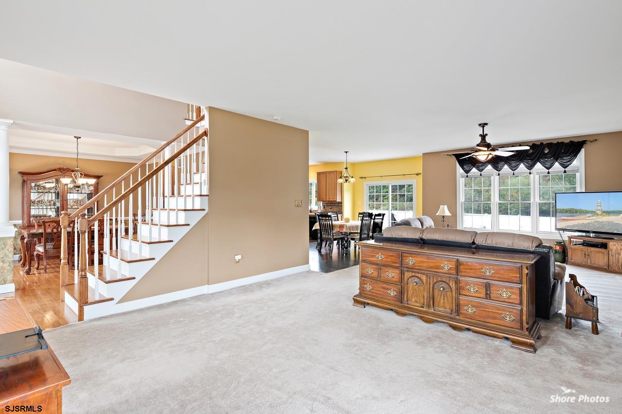 49 Killdeer Hill Road Woodbine, NJ 08270 - Photo 13 of 56 a living room with furniture a chandelier and a flat screen tv