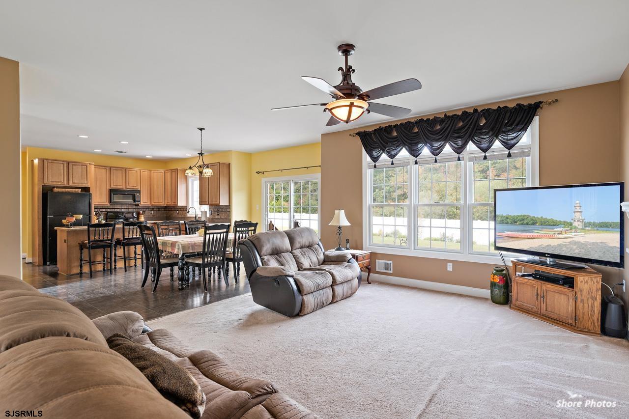 49 Killdeer Hill Road Woodbine, NJ 08270 - Photo 16 of 56 a living room with furniture and a flat screen tv