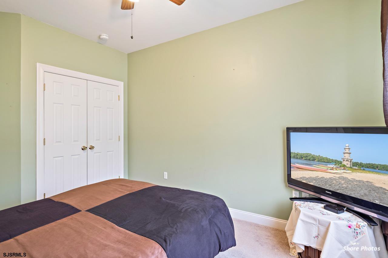 49 Killdeer Hill Road Woodbine, NJ 08270 - Photo 26 of 56 a bedroom with a bed and a dresser in it