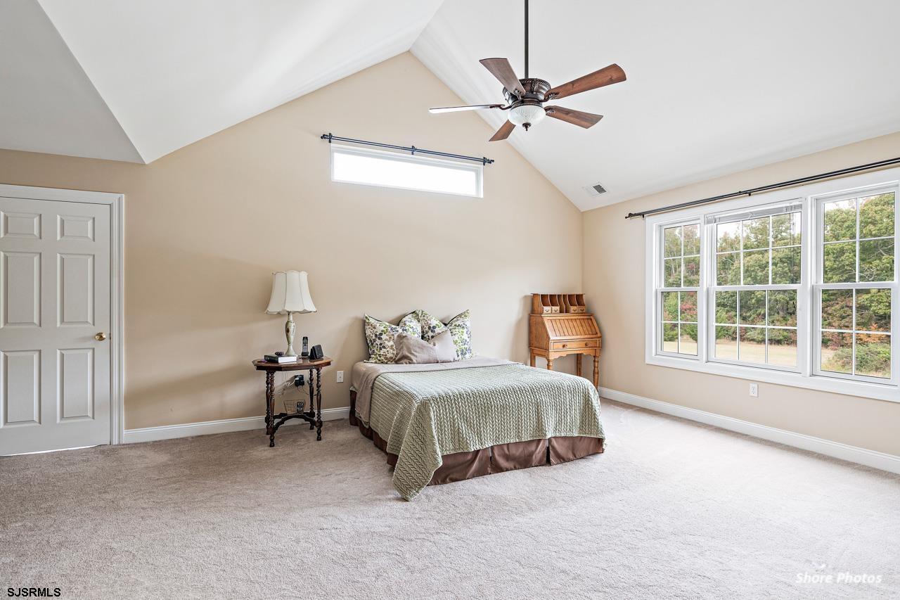 49 Killdeer Hill Road Woodbine, NJ 08270 - Photo 30 of 56 a spacious bedroom with a bed and window