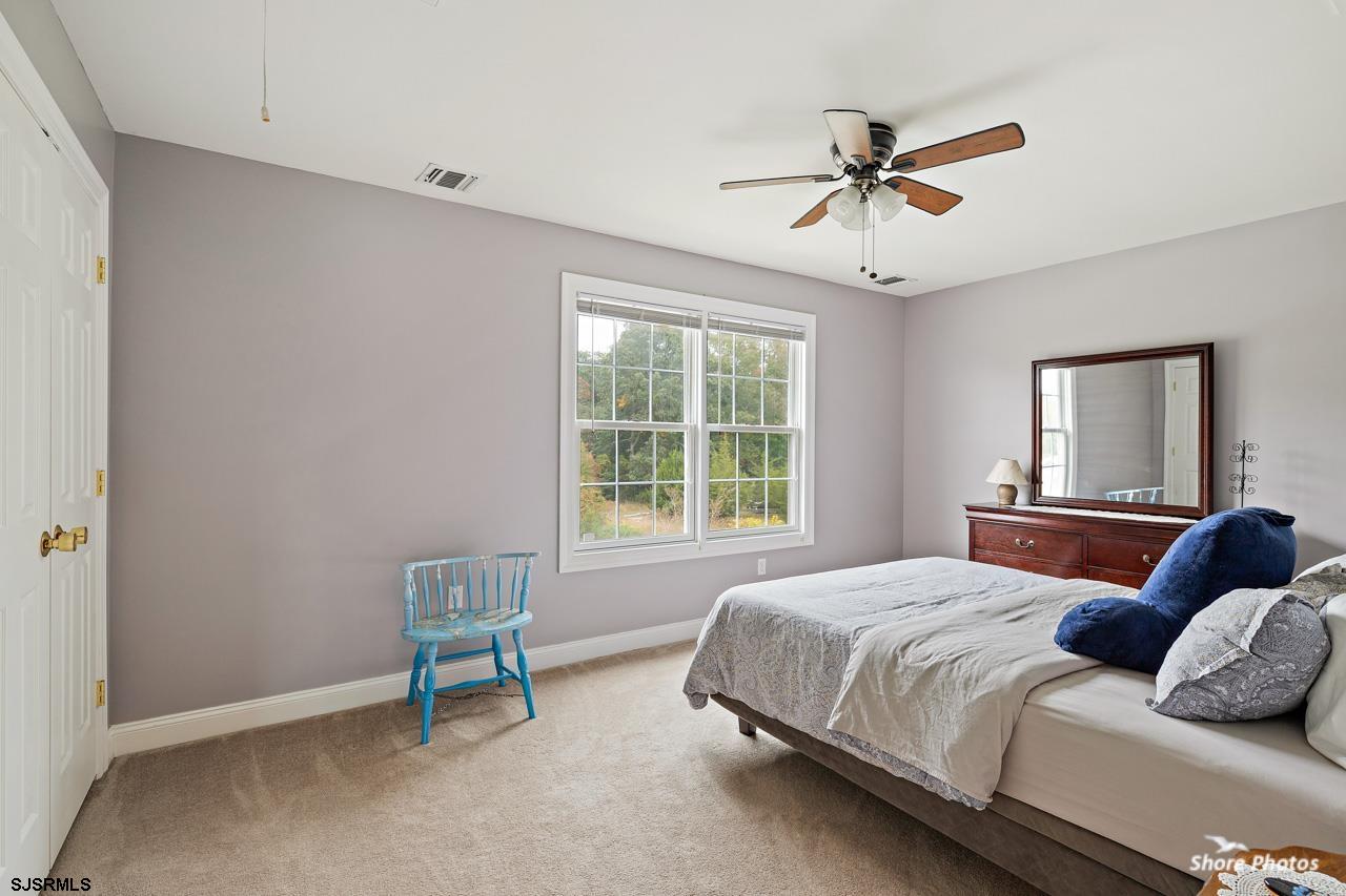 49 Killdeer Hill Road Woodbine, NJ 08270 - Photo 38 of 56 a bedroom with a bed and a window