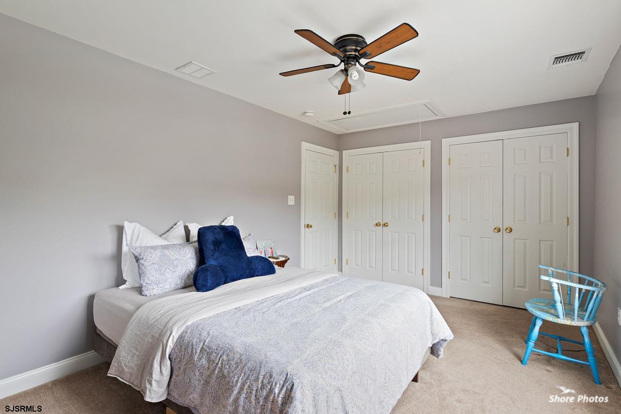 49 Killdeer Hill Road Woodbine, NJ 08270 - Photo 39 of 56 a bedroom with a bed and a ceiling fan