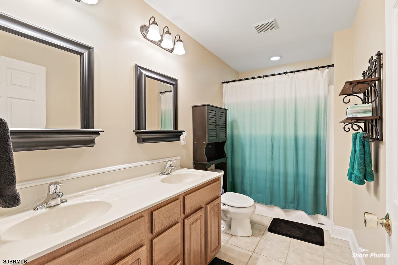 49 Killdeer Hill Road Woodbine, NJ 08270 - Photo 42 of 56 a bathroom with a granite countertop sink toilet and shower