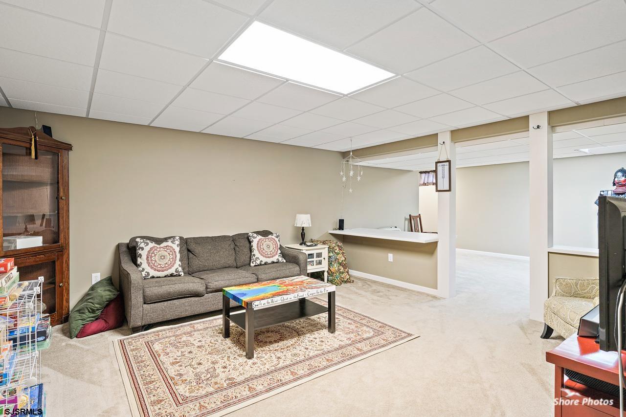 49 Killdeer Hill Road Woodbine, NJ 08270 - Photo 45 of 56 a living room with furniture and a flat screen tv
